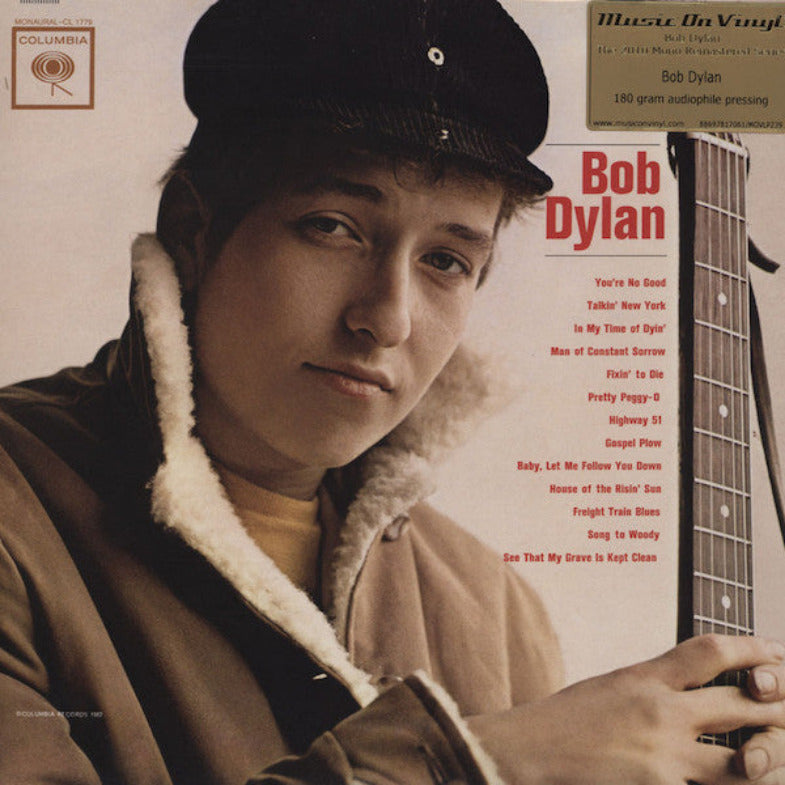 Album cover featuring Bob Dylan holding a guitar with text and Columbia Records logo.