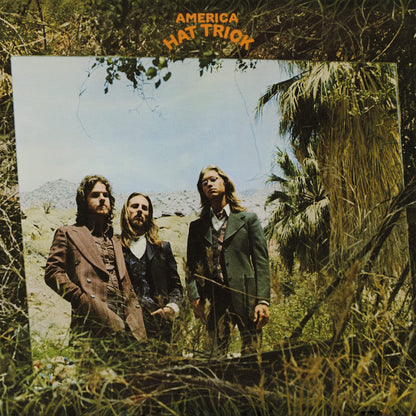 America - Hat Trick (Limited Edition Import, Orange & Black Mix Vinyl) (LP) - Joco Records