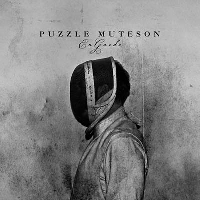 Puzzle Muteson - En Garde (7 - Inch Single) - Joco Records